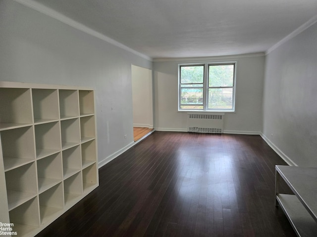 67-12 Yellowstone Blvd Unit C12, New York City, NY 11375 - spare room with radiator, crown molding, dark wood-type flooring, and baseboards