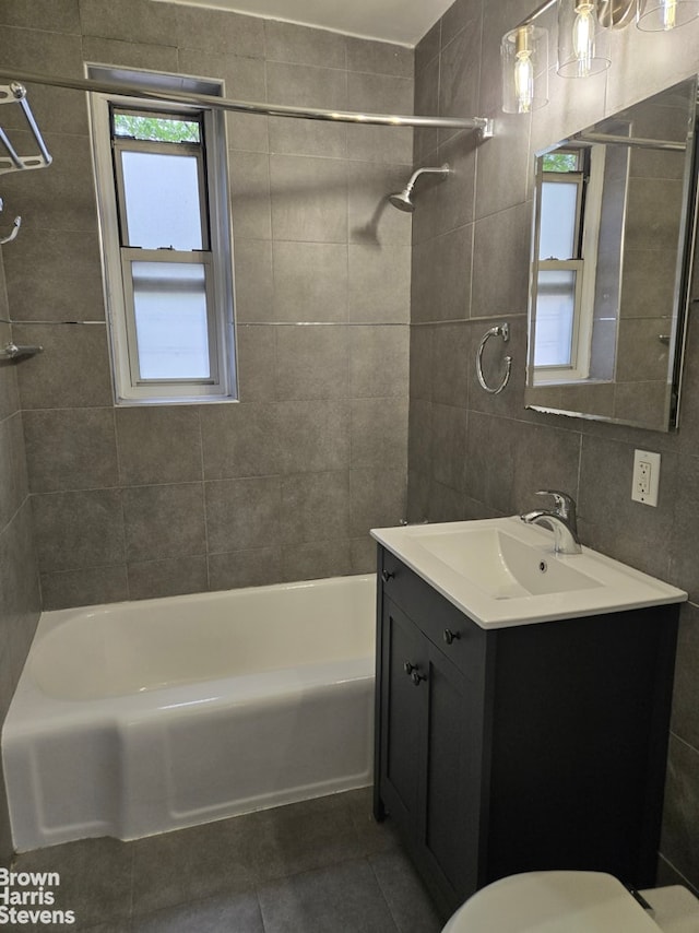 67-12 Yellowstone Blvd Unit C12, New York City, NY 11375 - full bath with tile patterned flooring, vanity, shower / tub combination, toilet, and tile walls