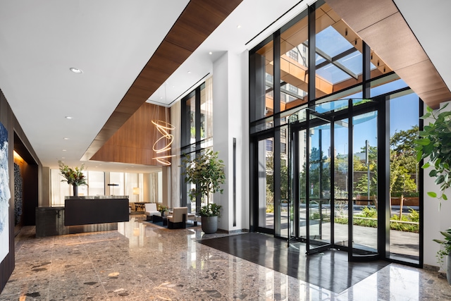 50 Bridge Park Dr Unit 17E, New York City, NY 11201 - community lobby featuring a towering ceiling, recessed lighting, and expansive windows