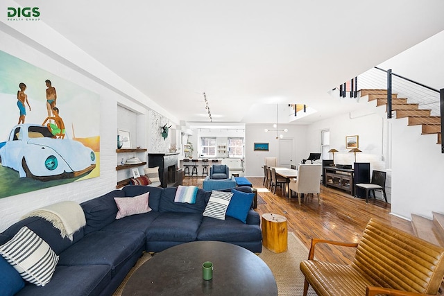 living room with hardwood / wood-style flooring and stairway
