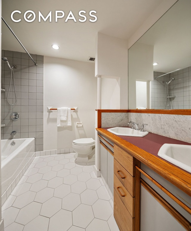 115 4th Ave Unit 2I, New York City, NY 10003 - bathroom with tile patterned flooring, toilet, shower / bathtub combination, vanity, and recessed lighting