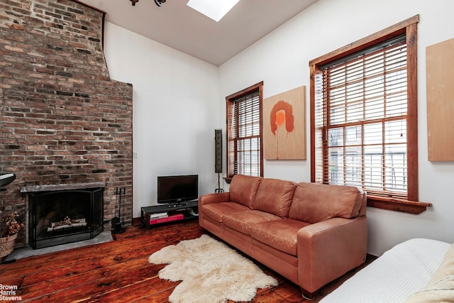 301 Water St, New York City, NY 11201 - living area featuring hardwood / wood-style floors, healthy amount of natural light, a brick fireplace, and lofted ceiling