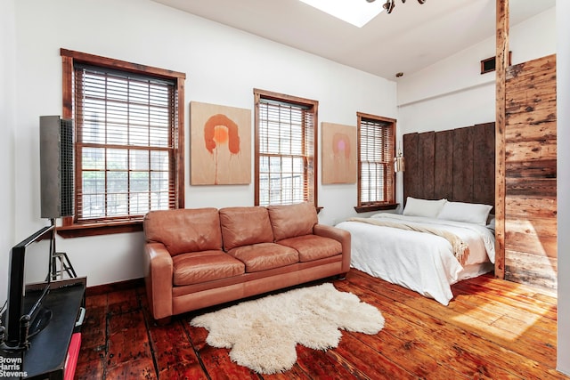 301 Water St, New York City, NY 11201 - bedroom with wood-type flooring, multiple windows, and vaulted ceiling