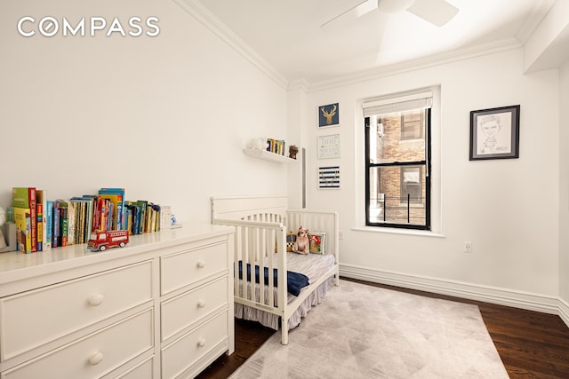 315 E 80th St Unit 2J, New York City, NY 10075 - bedroom with crown molding, dark wood-type flooring, and a ceiling fan