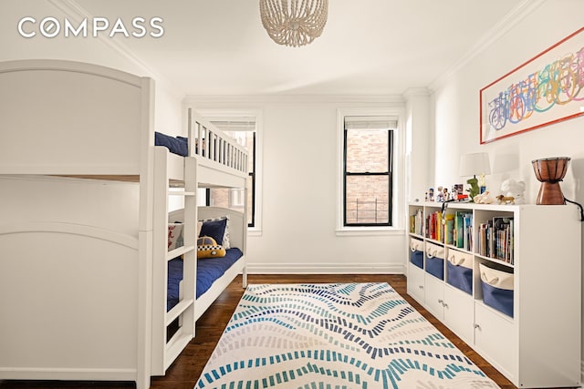 315 E 80th St Unit 2J, New York City, NY 10075 - bedroom with dark wood-type flooring, ornamental molding, and baseboards