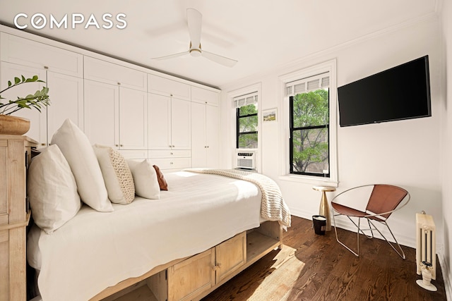 315 E 80th St Unit 2J, New York City, NY 10075 - bedroom featuring baseboards, dark wood-type flooring, a ceiling fan, cooling unit, and radiator