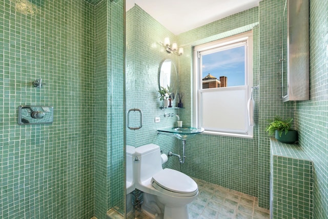 full bath featuring tile walls, tiled shower, and toilet