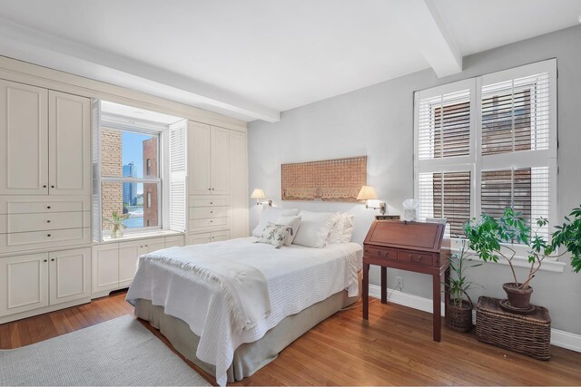 434 E 52nd St Unit 6Ab, New York City, NY 10022 - bedroom featuring beamed ceiling and light wood-type flooring