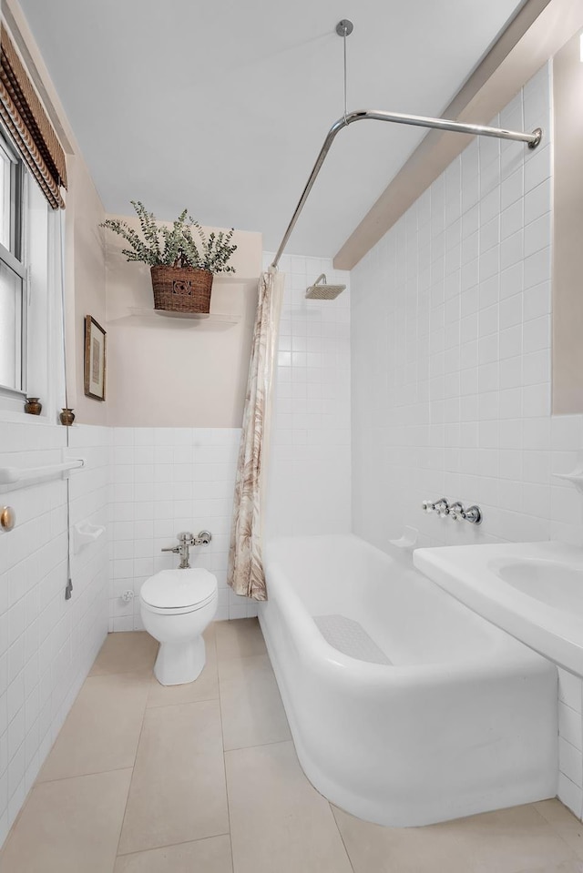 434 E 52nd St Unit 6Ab, New York City, NY 10022 - full bathroom with tile walls, toilet, shower / bath combination with curtain, and tile patterned flooring