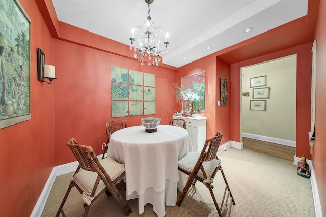 434 E 52nd St Unit 6Ab, New York City, NY 10022 - dining area with light colored carpet, a chandelier, and recessed lighting