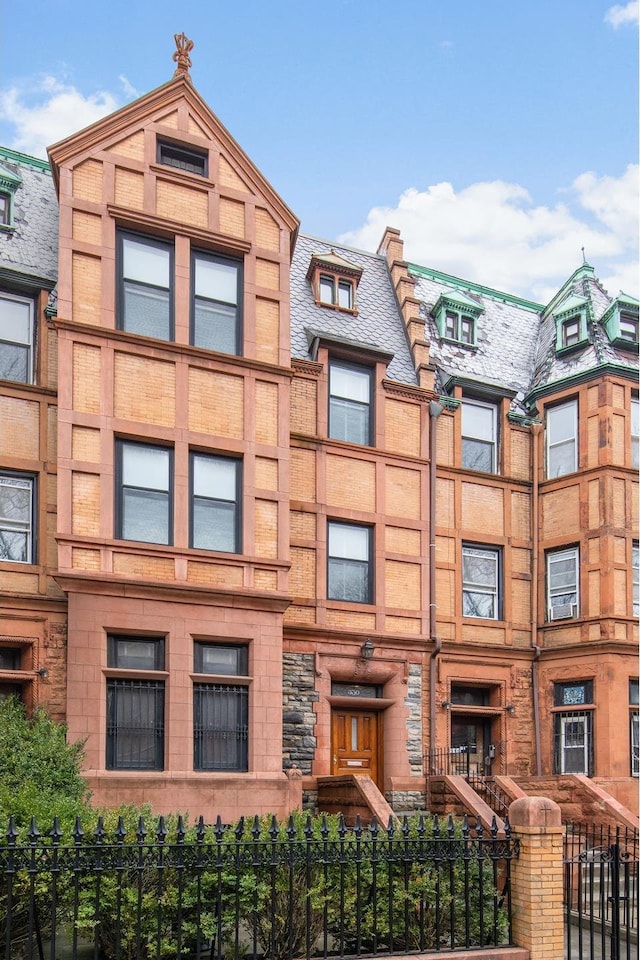 330 Convent Ave, New York City, NY 10031 - view of building exterior with a fenced front yard