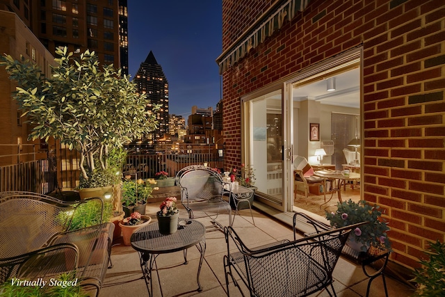 345 E 52nd St Unit 11D, New York City, NY 10022 - balcony at twilight with a view of city lights