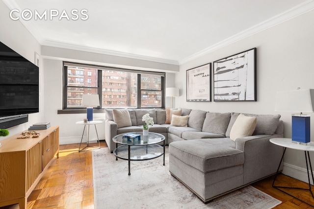 living room featuring crown molding and baseboards
