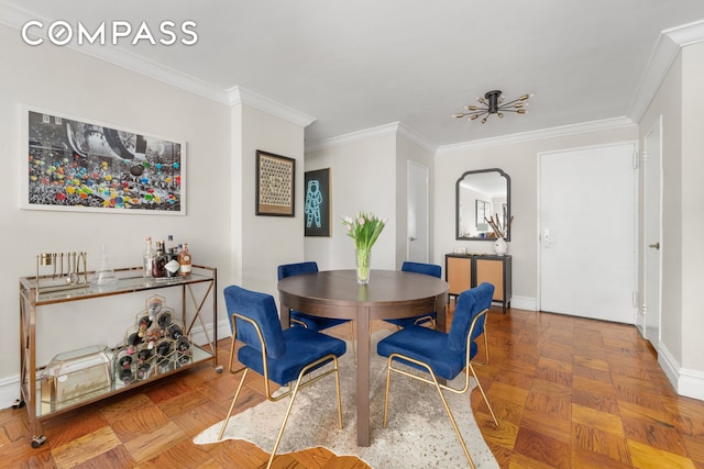 dining area featuring baseboards and ornamental molding