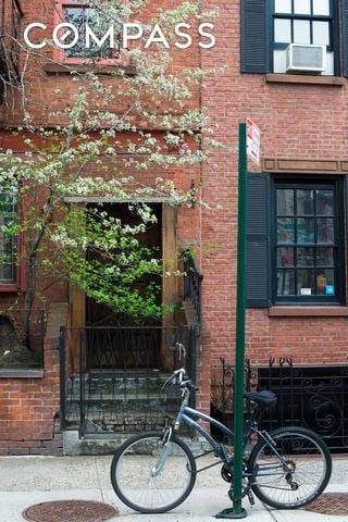 15 Jones St Unit 5H, New York City, NY 10014 - view of exterior entry with brick siding and cooling unit