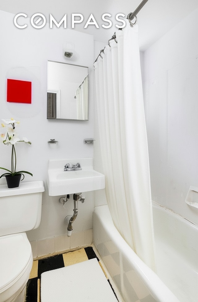 15 Jones St Unit 5H, New York City, NY 10014 - bathroom with shower / bath combo and toilet