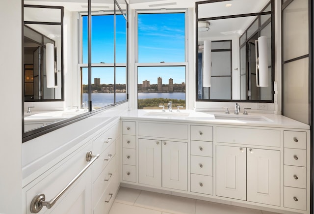 90 Riverside Dr Unit 14A, New York City, NY 10024 - full bathroom with double vanity, a water view, and tile patterned floors