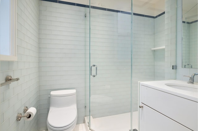 90 Riverside Dr Unit 14A, New York City, NY 10024 - bathroom with a stall shower, vanity, and tile walls