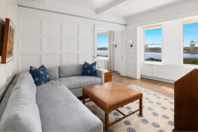 90 Riverside Dr Unit 14A, New York City, NY 10024 - living room with a decorative wall, light wood-type flooring, beamed ceiling, and a water view