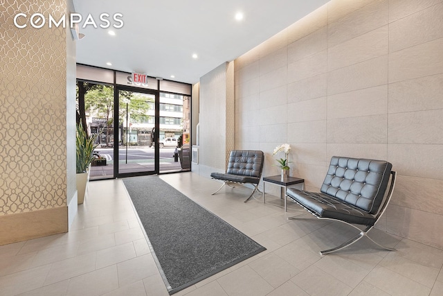 502 9th Ave Unit 4A, New York City, NY 10018 - building lobby featuring expansive windows and recessed lighting