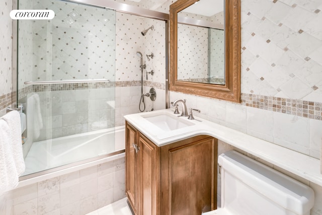 233 E 69th St Unit 14Klm, New York City, NY 10021 - full bathroom featuring tile walls, tiled shower / bath combo, toilet, and vanity