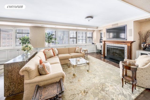 233 E 69th St Unit 14Klm, New York City, NY 10021 - living room with crown molding, wood finished floors, plenty of natural light, a fireplace, and a decorative wall