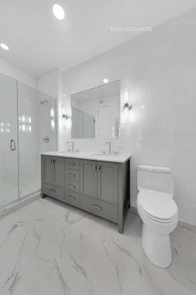 full bath featuring a stall shower, toilet, marble look tiles, double vanity, and recessed lighting
