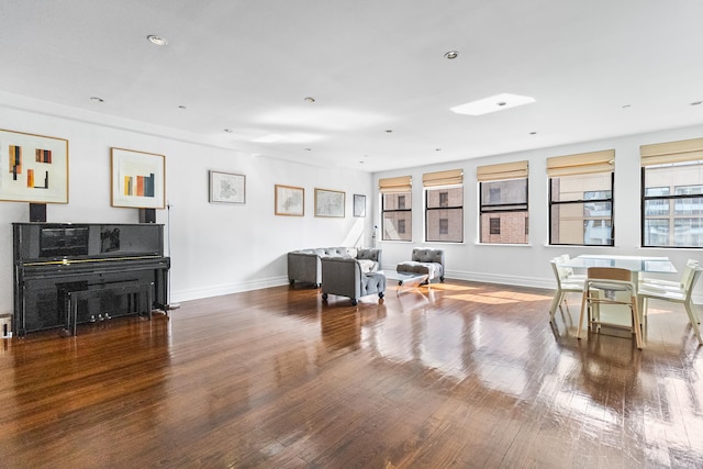 133 W 14th St Unit 6Ph, New York City, NY 10011 - living area featuring wood finished floors, baseboards, and recessed lighting