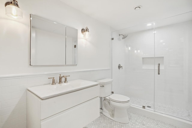119 Henry St Unit 1, New York City, NY 11201 - bathroom with tile walls, vanity, toilet, a shower stall, and tile patterned floors