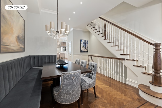 169 E 71st St, New York City, NY 10021 - dining area with ornamental molding, stairway, a chandelier, wainscoting, and a decorative wall