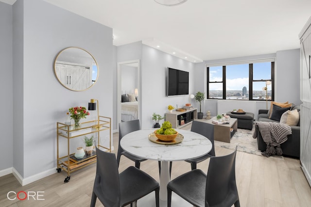 201 E 17th St Unit 32A, New York City, NY 10003 - dining area featuring light wood-type flooring, baseboards, and recessed lighting