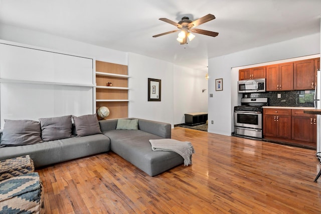 410 W 23rd St Unit 4E, New York City, NY 10011 - living area with ceiling fan and wood finished floors