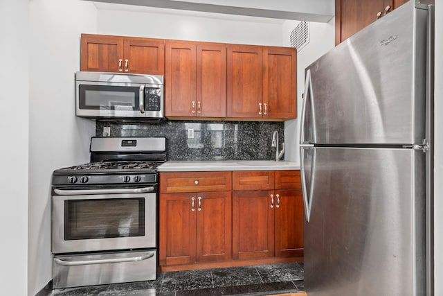 410 W 23rd St Unit 4E, New York City, NY 10011 - kitchen featuring stainless steel appliances, a sink, decorative backsplash, and light countertops