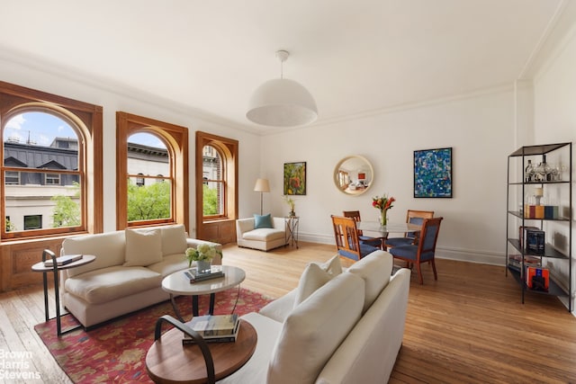 14 E 92nd St Unit 4, New York City, NY 10128 - living area featuring hardwood / wood-style flooring, baseboards, and crown molding