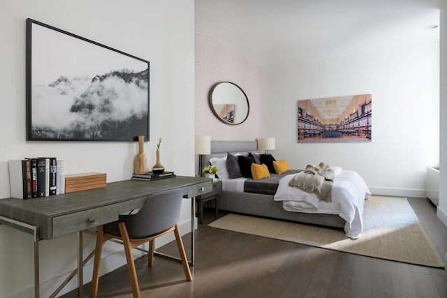 bedroom featuring wood finished floors and baseboards