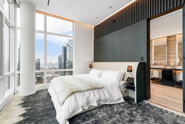 460 W 42nd St Unit Ph-1C, New York City, NY 10036 - bedroom featuring a view of skyline and floor to ceiling windows