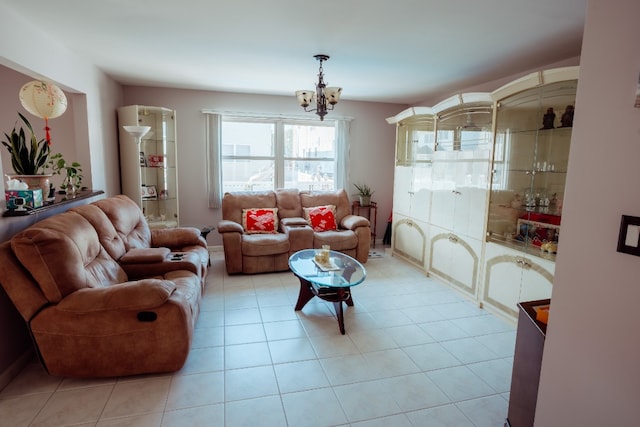 living room with a chandelier and light tile patterned floors
