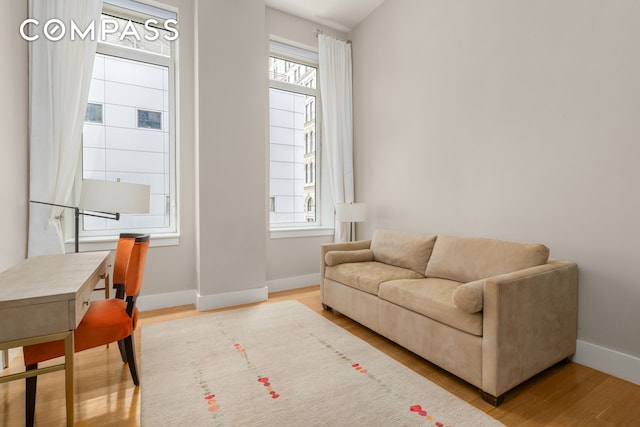 101 Leonard St Unit 2E, New York City, NY 10013 - living area with baseboards and wood finished floors
