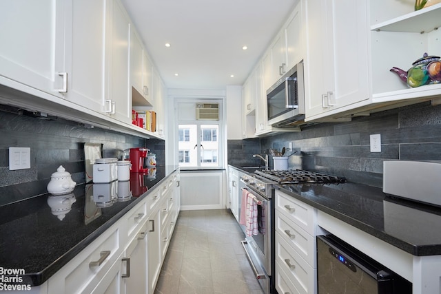 179 E 70th St Unit 11A, New York City, NY 10021 - kitchen with appliances with stainless steel finishes, open shelves, white cabinets, tasteful backsplash, and recessed lighting