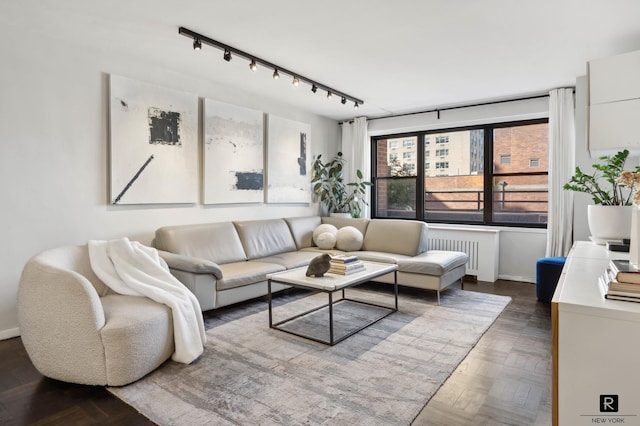 505 E 79th St Unit 17-D, New York City, NY 10075 - living room with radiator heating unit and track lighting