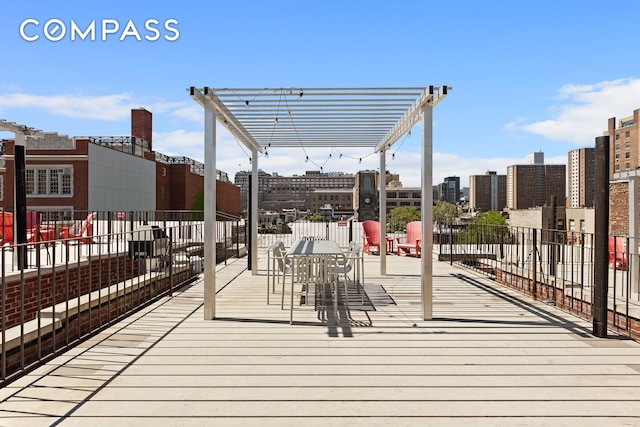 333 W 21st St Unit 2Fe, New York City, NY 10011 - wooden terrace with a view of city and a pergola
