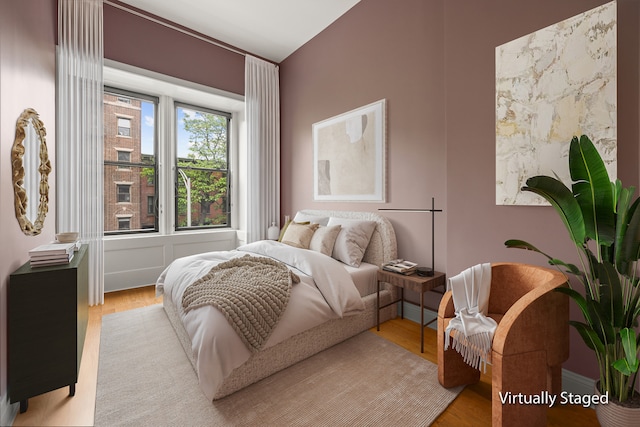 bedroom with wood finished floors