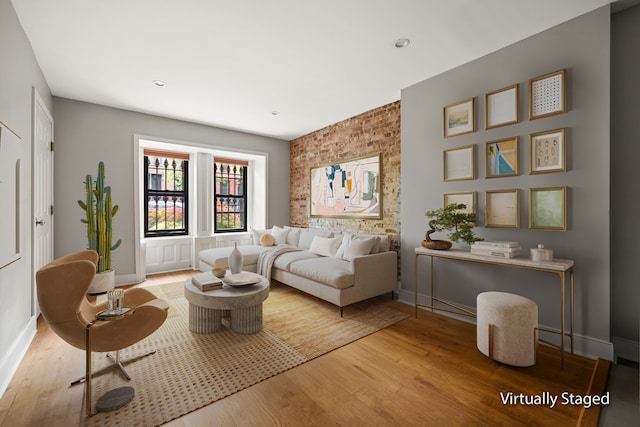 living area with wood finished floors, baseboards, and recessed lighting