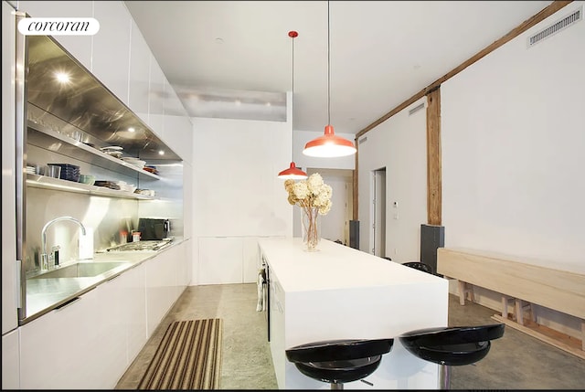 192 Water St Unit 1W, New York City, NY 11201 - kitchen featuring modern cabinets, a sink, a kitchen island, white cabinets, and light countertops