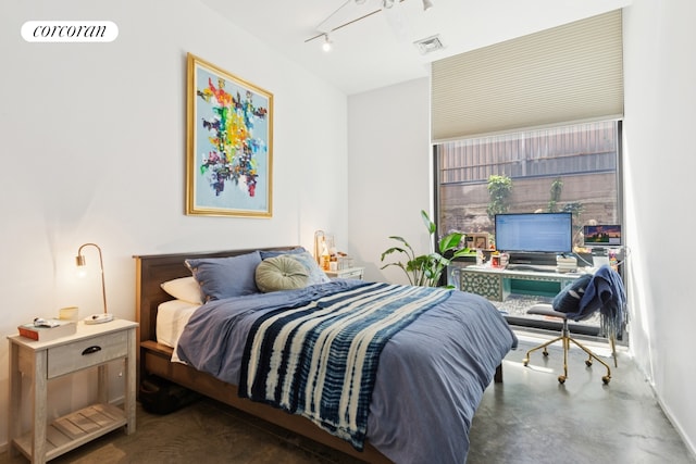 192 Water St Unit 1W, New York City, NY 11201 - bedroom with rail lighting and concrete floors