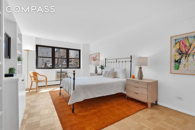 120 E 81st St Unit 8A, New York City, NY 10028 - bedroom with a baseboard radiator and baseboards