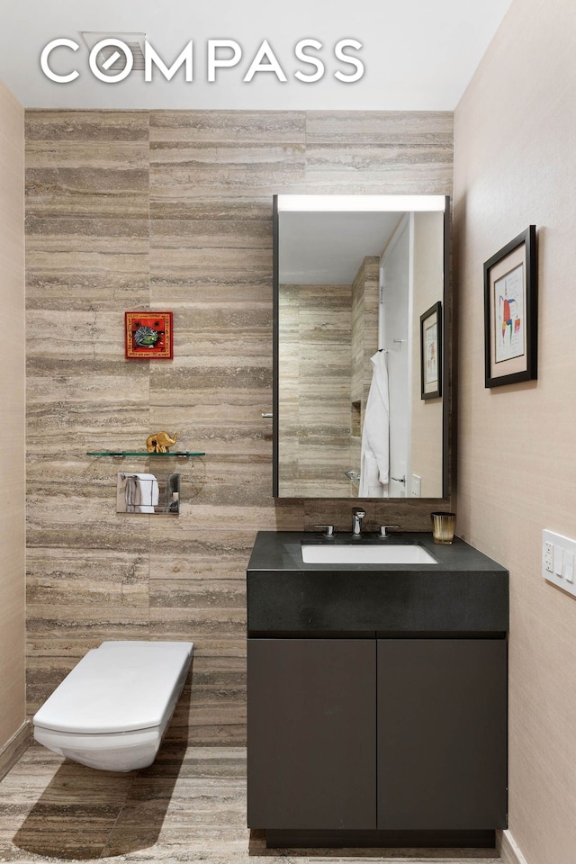 50 W St Unit 37C, New York City, NY 10006 - bathroom with vanity, tile walls, and toilet