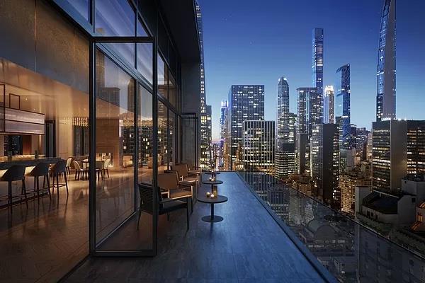685 5th Ave Unit 15B, New York City, NY 10022 - balcony at twilight featuring a view of city lights