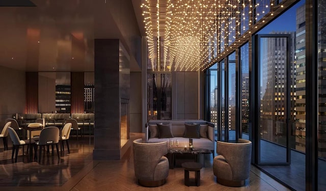 685 5th Ave Unit 15B, New York City, NY 10022 - community lobby with a towering ceiling, expansive windows, and a view of city lights
