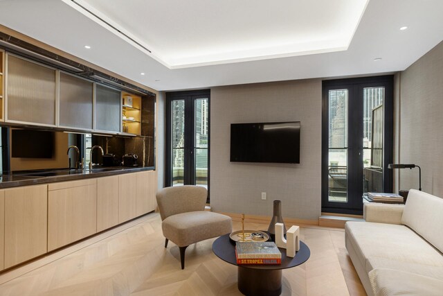 685 5th Ave Unit 15B, New York City, NY 10022 - living room featuring a raised ceiling and recessed lighting